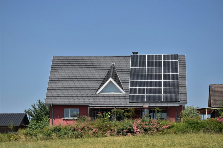 beautiful house with solar panels on the roof